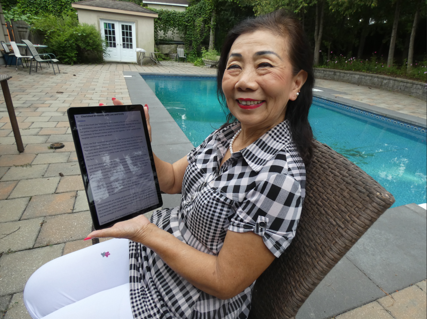 Mary exploring memories on a tablet outdoors